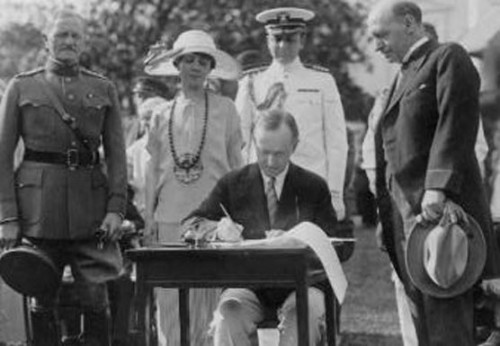 The President signing the Johnson-Reed Act, on the south lawn of the White House, May 26, 1924. 