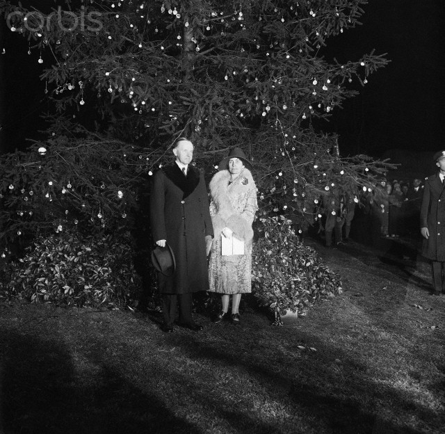 The Coolidges after the Christmas Tree has been lit, December 24, 1927. 