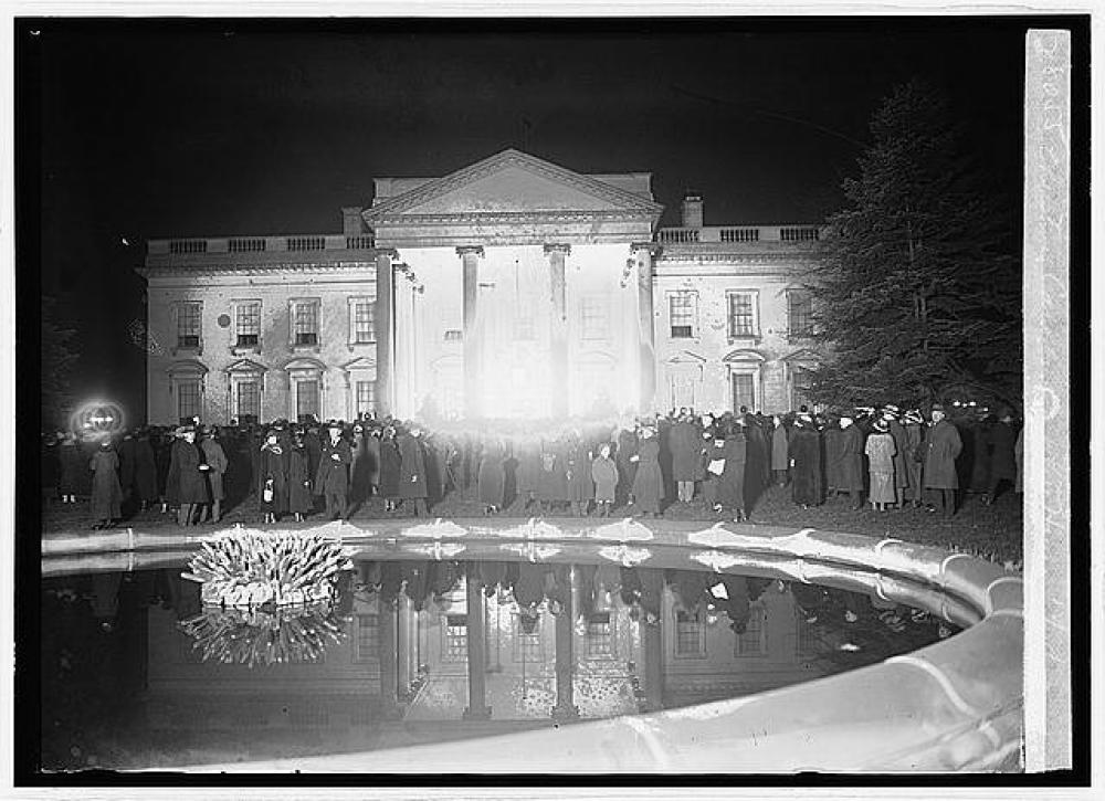 The singing of carols at the North Portico of the White House, a main feature of the Coolidges years, is pictured as it looked that first Christmas of 1923. 