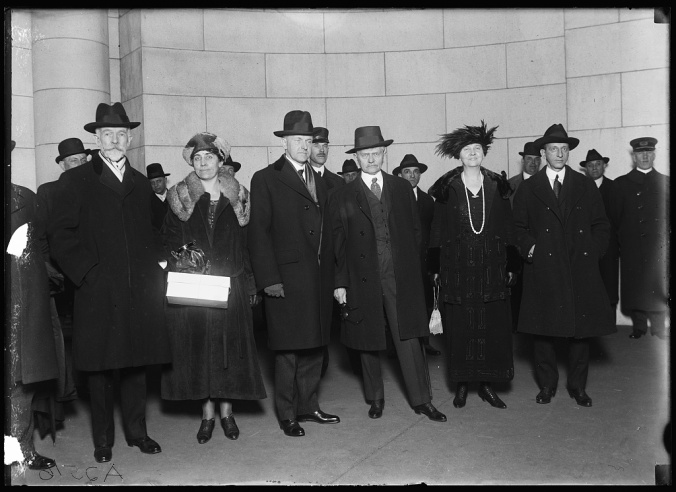 Senator Henry Cabot Lodge, a long-time political antagonist of Coolidge's advancement, stands beside Mrs. Coolidge and the Vice President, who stands beside outgoing Vice President Thomas Marshall and Mrs. Marshall. While not evident in this picture, Mr. Marshall possessed a keen sense of humor, hitting it off with the new VP almost immediately. The Marshalls helped the Coolidges get situated in Washington and became firm friends with his successor and the lovely Mrs. Coolidge. Photo taken in 1921. 