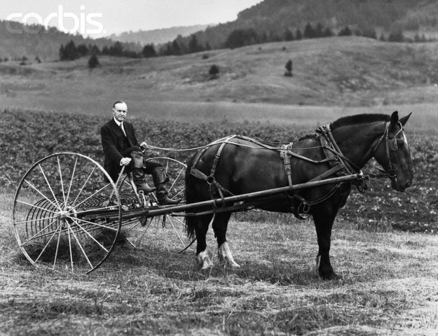 Former President at his Vermont family farm. He and his horse are ready to put the hay baler to work, July 1931. 