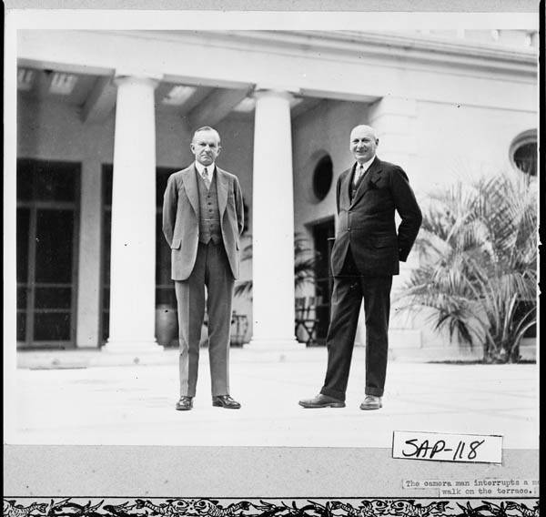 Calvin Coolidge and his friend and host, entrepreneur Howard E. Coffin, as they walk the terrace of "The Big House" built by Thomas Spalding, 1810, Sapelo Island. 