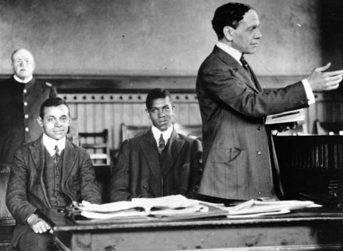 William H. Lewis, standing, argues a case before a Massachusetts court, 1910s. He had graduated Amherst three years before Coolidge, who wrote his father at the time about Lewis' skill as a football player, saving the college team on more than one occasion. Lewis, a Republican, failed to see why Coolidge would not verbally condemn the Klan in 1924. Lewis failed to appreciate Coolidge's subtle yet more effective approach to the problem. 