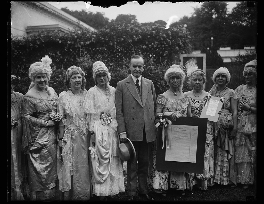 Holding the "Nation's Birthday Book" these Daughters visit President Coolidge in preparation for the Sesquicentennial that year, 1926. 