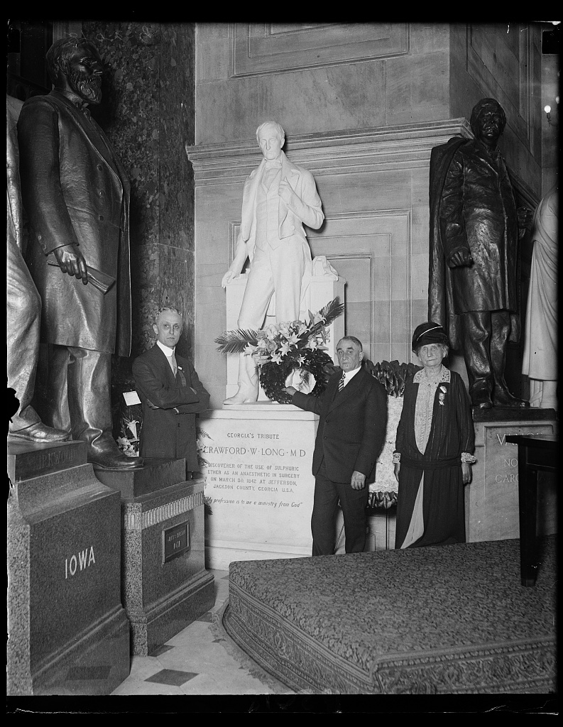 Gathered to honor the memory of the American who discovered the aesthetic properties in surgery of sulphuric ether, Dr. Thomas A. Grooner, Dr. Charles H. Mayo and the daughter of Dr. Long, visit the statue of Crawford from Georgia, May 16, 1927. 