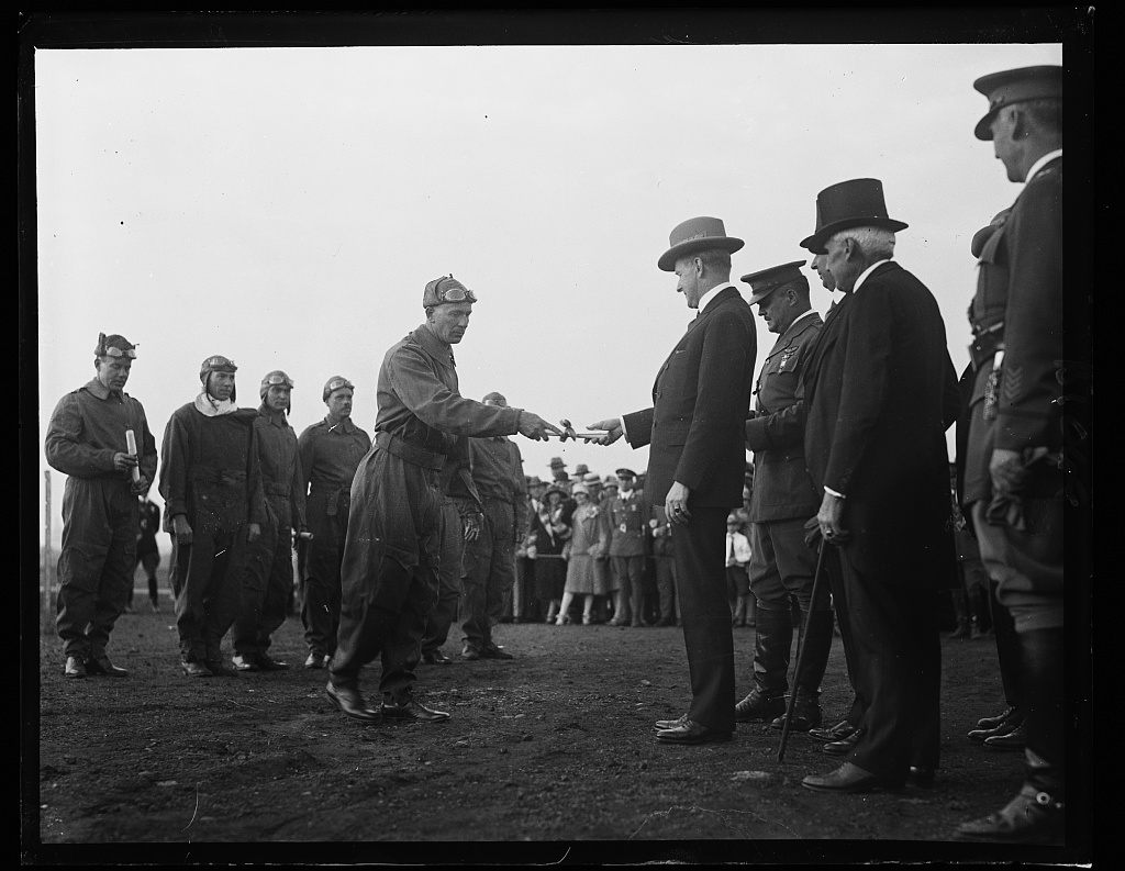 President Coolidge gave the Distinguished Flying Cross certificate for the first time just over a month before the Lindbergh ceremony. Here Major Herbert A. Dargue accepts one of the ten awards bestowed that day, May 2, 1927. Two would be given posthumously in recognition of Captain Clinton Woolsey and Lieutenant John Benton who tragically died from collision with another of the 5 ships to take part in the Pan-American Goodwill Flight, February 26, 1927. 