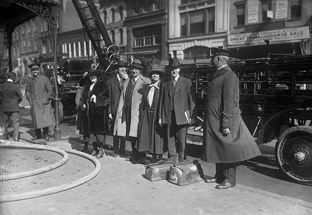 As the fire is put out, the Coolidges and some of their fellow guests watch from below. L to R: Miss J. Letley, A.H. Duerno, of Springfield Mass., O.H. Wigley of New York, Mrs. Coolidge and Vice President. Coolidge. Courtesy of Corbis Images. 