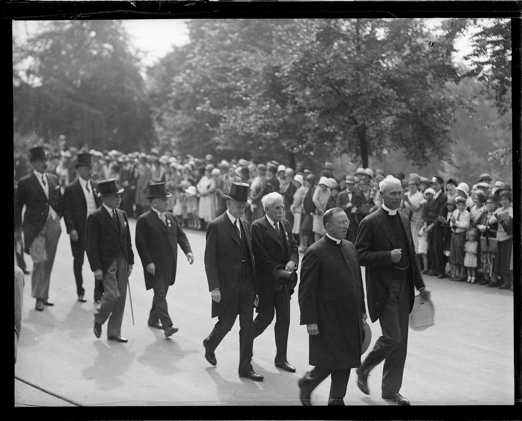 Former President Coolidge walking with fellow citizens in the parade celebrating the Tercentenary of Boston, July 1930. 