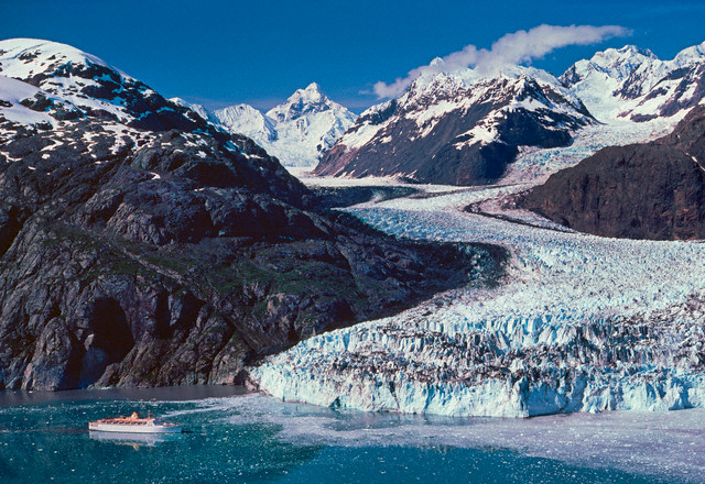 11. Glacier Bay National Monument, established  February 26, 1925. Margerie Glacier sprawls before a cruise ship visiting the site. Courtesy of Danny Lehman/Corbis. 