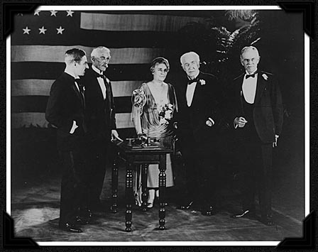Secretary Mellon presenting Edison the Congressional Gold Medal, accompanying recognition by President Coolidge over radio hookup from the White House. L to R: Ronald Campbell (British Embassy, present to return the original phonograph lent by Edison to the British Science Museum 45 years earlier), Mellon, Mina and Thomas Edison, with John Hibben, President of Princeton University. Courtesy of the Smithsonian Institution. 