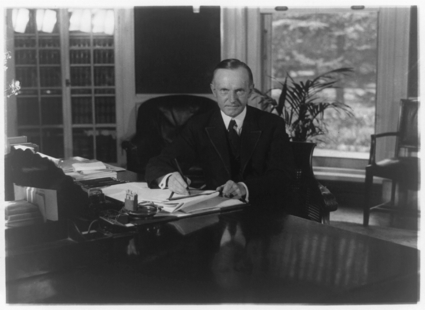 The President working at his desk, August 1923. 