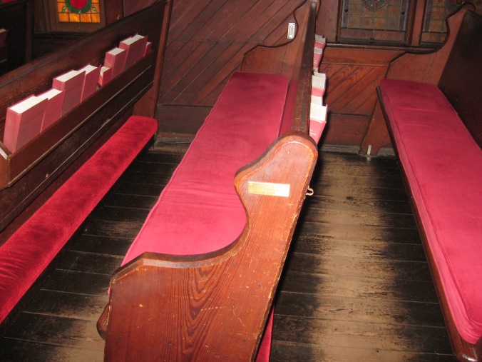 The Coolidge Pew, where the President and Mrs. Coolidge sat during the services. The plaque is mismarked, dating the service on a Monday instead of Sunday, December 30. 