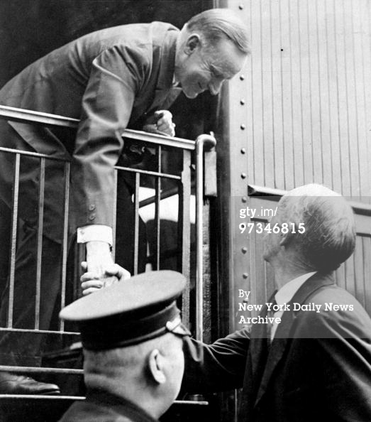 Coolidge shaking hands with a fellow citizen, as he boards a train for New York, February 3, 1924. Courtesy of Getty Images. 