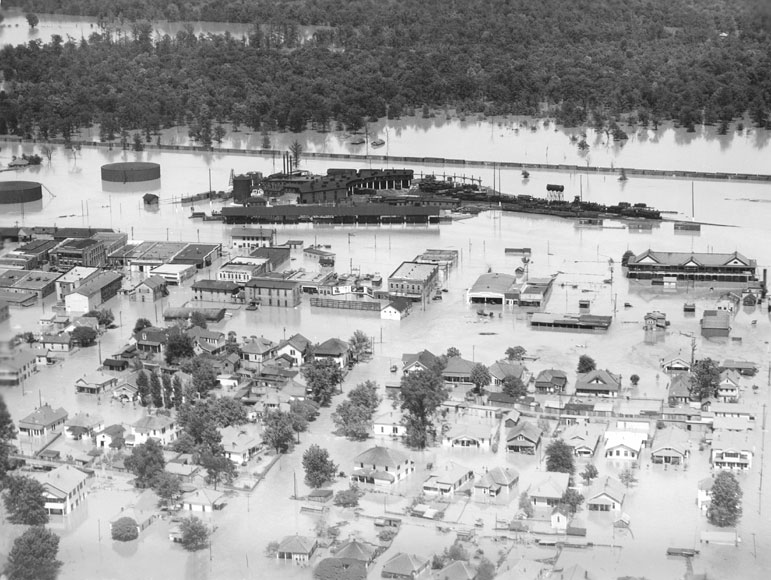 Flood damage in McGehee, Arkansas, May 1927. See http://kaiology.wordpress.com/2011/08/13/coolidge-and-the-1927-mississippi-flood/. 