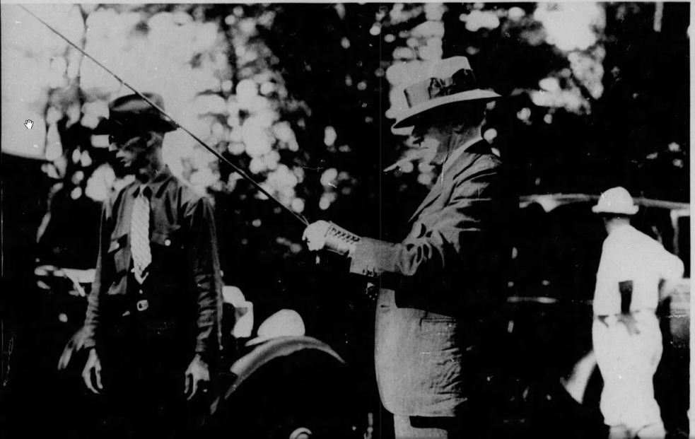 Coolidge preparing for trout, July 19, 1929. 