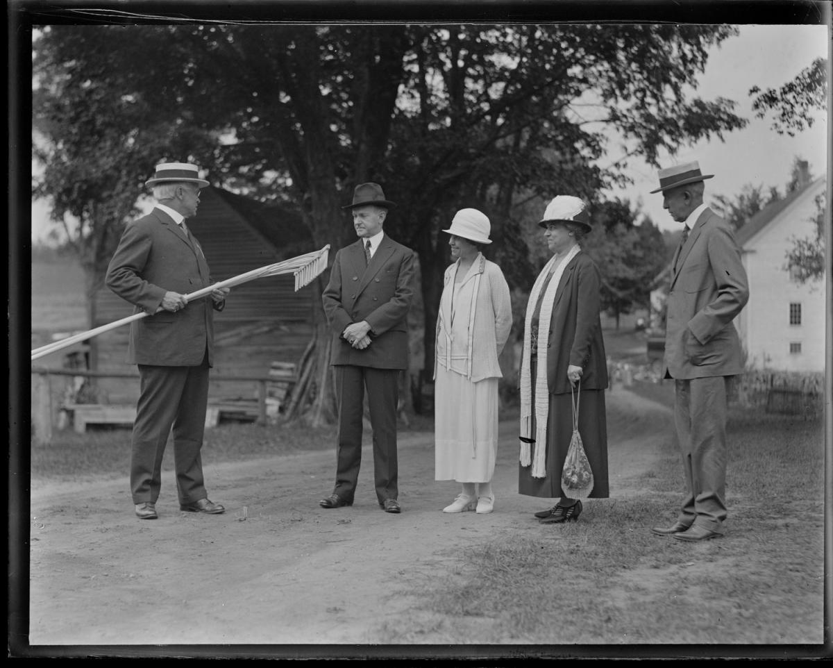 In August 1924, the Coolidges were comforted by the visit of long-time friendly faces from the days when both served in the Massachusetts General Court, Colonel and Mrs. Treadway. Now representing the first congressional district of their state, Colonel Treadway presents the gift of two custom-crafted hay rakes for the President to use on the Homestead. 