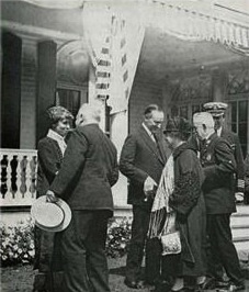 The Coolidges greeting visitors to the summer White House at White Court, where Executive business kept going throughout the summer,1926. 
