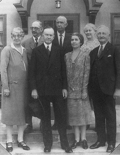 Former President Coolidge with Mrs. Coolidge, joined by the owners, operators and designers of Lakeside Inn in the 1930s. L to R: Mrs. F. W. Wentworth, architect Fred W. Wentworth, the Coolidges, Archie Hurlburt, manager of Lakeside, and Mr. and Mrs. Charles Edgerton. The Coolidges stayed in Mount Dora at the Inn from January to February 1930. 