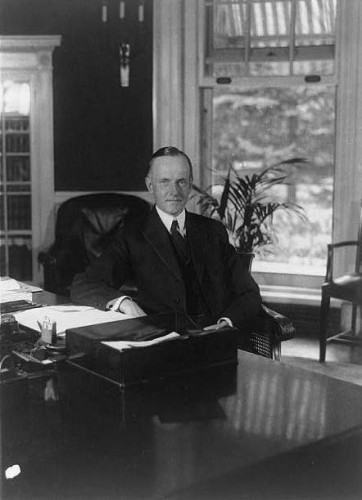 President Coolidge at his desk in the Executive Offices, August 15, 1923. 
