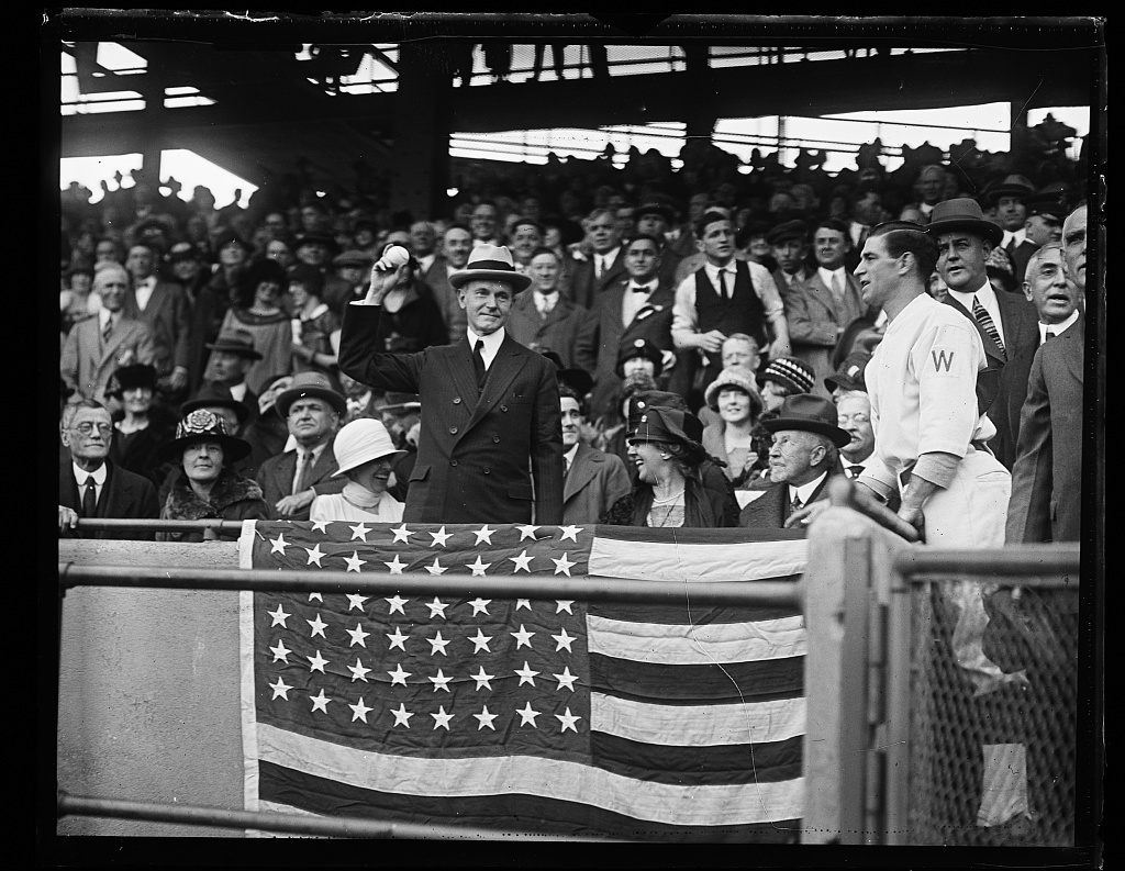 President Coolidge throwing out the first pitch, Griffith Stadium, as the Senators host the Giants, October 1924. Courtesy of the Library of Congress. 