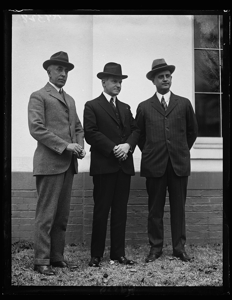 The President with outgoing secretary C. Bascom Slemp and incoming Everett Sanders, January 19, 1925, outside the Executive Offices. 