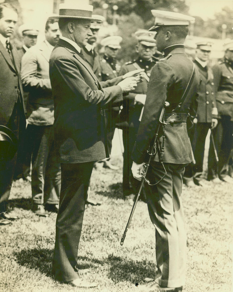 President Coolidge bestowing the Medal of Honor upon Lieutenant Christian Schilt for his actions under fire in Quilali, Nicaragua, six months before. 