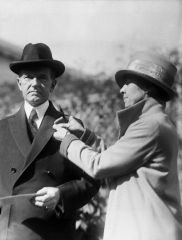 Calvin Coolidge Being Pinned by His Wife
